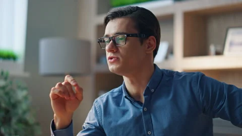 Smiling designer computer videocalling in cabinet close up. Startuper talking Video stock 243224370