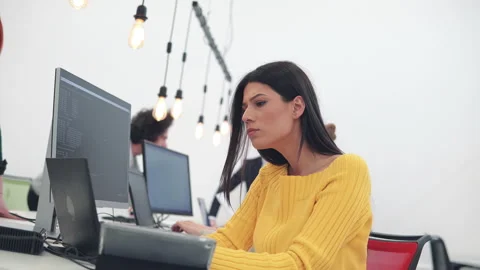 Smiling developer co-working with colleagues at coworking startup office Stock Footage 150064877