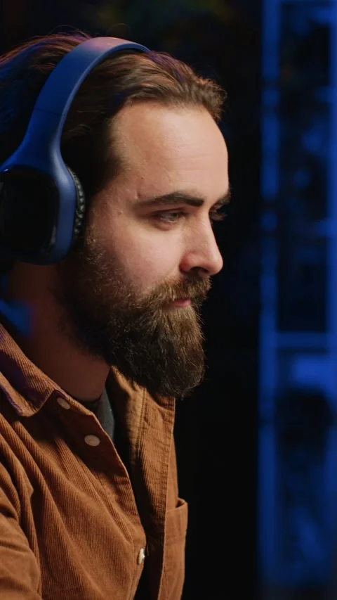 Smiling developer listening music while doing programming, close up Stock Footage 264511868