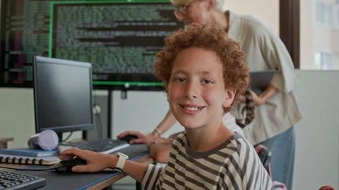 Smiling Diligent Schoolboy Looking at Camera at Programming Lesson Stock Footage 316478613