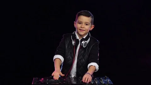 Smiling dj in leather jacket playing on turntable. Slow motion Stock Footage 75916376