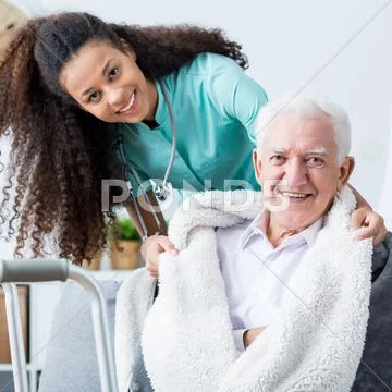 Smiling doctor caring about patient Stock Photos