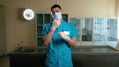 Smiling doctor, preparing for surgery Video stock 151786093