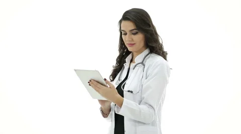 Smiling doctor using tablet and looking at camera on white background. Stock Footage 60094754