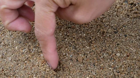 Smiling drawing in the sand. Video stock 104603696