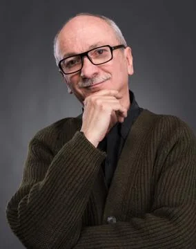 Smiling elderly man in glasses Stock Photos