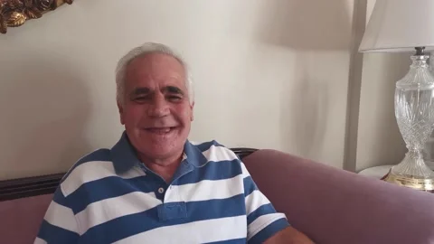Smiling Elderly Man Looking at Camera Stock Footage 141769371