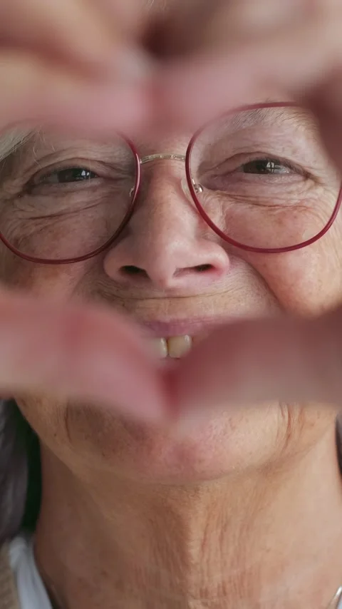 Smiling Elderly Woman Forms a 스톡 동영상 332684789