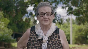 Smiling elderly woman looking at camera Stock Footage 85771936
