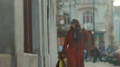 Smiling elegant 40 years old woman in orange trench coat Stock Footage 282312785