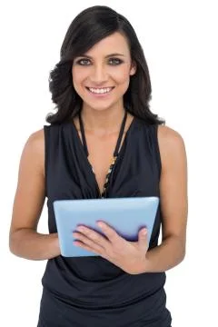 Smiling elegant brown haired model using tablet-computer Stock Photos