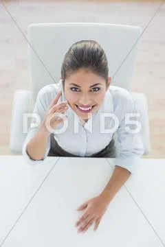 Smiling elegant businesswoman using cellphone Stock Photos