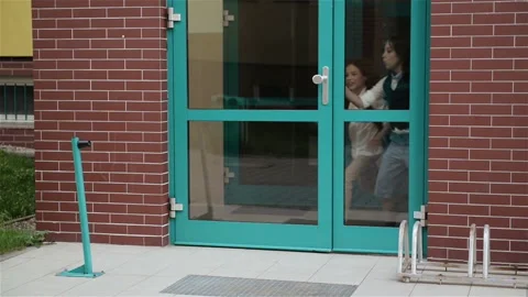Smiling Elementary School Children Happy To Go Home. Joyful School Girls And Stock Footage 111427811