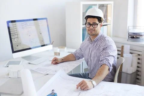 Smiling Engineer Posing at Workplace Stock Photos