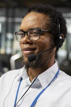 Smiling engineer providing user technical support in tech company office Stock Photos