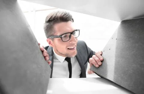 Smiling engineer selects documents in officce Stock Photos