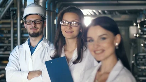 Smiling Engineers at the plant Stock Footage 77544590