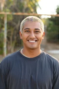 Smiling ethnic man looking at camera Stock Photos