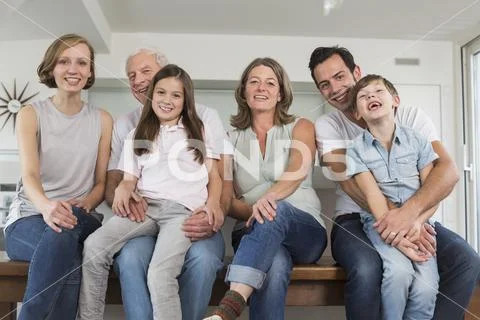 Smiling extended family side by side, portrait Stock Photos
