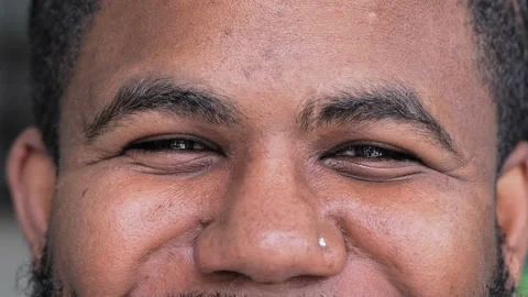 Smiling Eyes Of Young Black Man With Nose Piercing In Close View Looking At Came Stock Footage 321548838