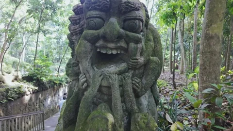 Smiling face and monkey statue in the Monkey Forest, Ubud, Bali, Indonesia. Stock Footage 271442307