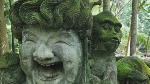 Smiling face and monkey statue in the Monkey Forest, Ubud, Bali, Indonesia. Stock Footage 271467551
