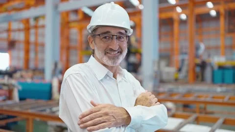 Smiling face of engineer manager standing with arms cross and looking at camera 스톡 동영상 237009036