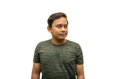 Smiling face expression of young Asian Malay man looking at empty space. Stock Photos