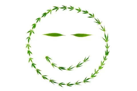 Smiling face with gooks made of hemp leaves Stock Photos