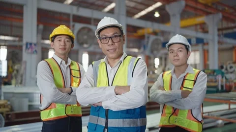 Smiling face team machine technicians standing with arms crossed looking camera. Stock Footage 241903172