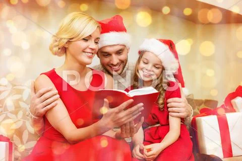 Smiling family reading book Stock Photos