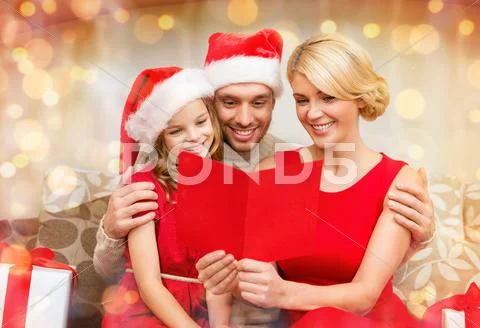 Smiling family reading postcard Stock Photos