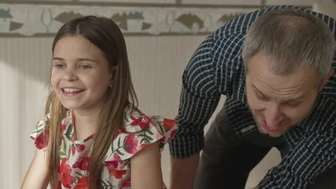 Smiling father having fun with cute child at home Stock Footage 157179751