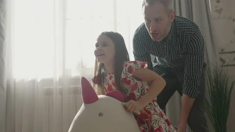 Smiling father having fun with cute child at home Stock Footage 157230895