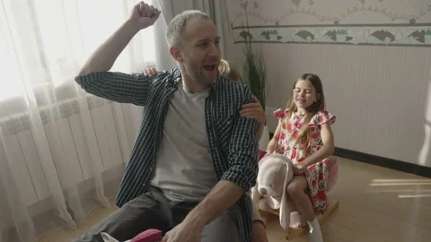 Smiling father having fun with cute children at home Stock Footage 157481805
