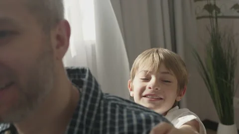 Smiling father having fun with cute children at home Stock Footage 157496194