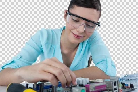 Smiling female computer engineer repairing computer motherboard Stock Photos