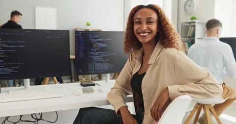 Smiling female developer at computer workstation in modern office, coding Stock Footage 338296884