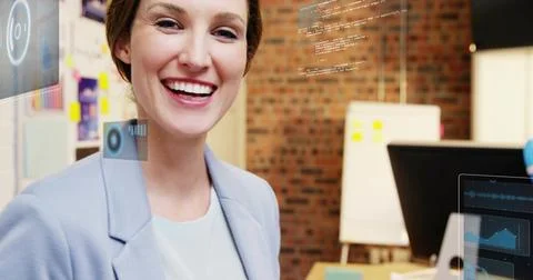 Smiling female developer presenting code overlays in office on whiteboard and 写真素材