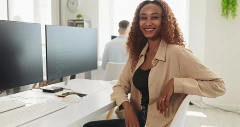 Smiling female developer at workstation in modern office, coding on computers Stock-Footage 348148391
