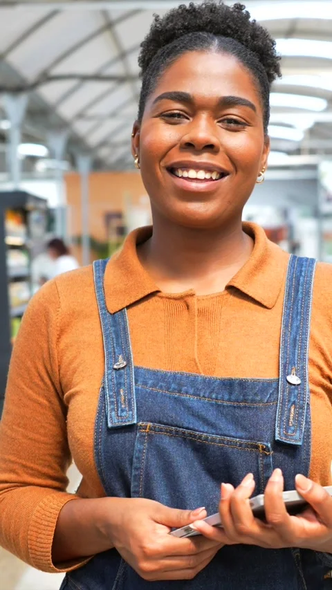 Smiling female employee using tablet in retail store Stock Footage 311304734