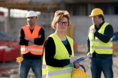 Smiling female engineer posing Stock Photos