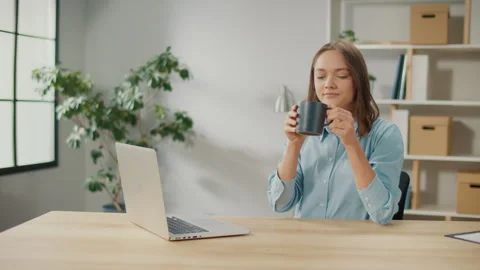 Smiling Female Office Worker Having Coffee Break in Coworking. Stock Footage 241378332