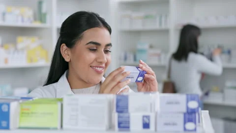 Smiling female pharmacy student working with store stock. Laughing healthcare Stock Footage