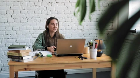 Smiling female student elearning study with online tutor teacher talk conference Stock Footage 153465104