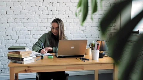Smiling female student in glasses elearning study with online tutor teacher talk Stock Footage 153609587