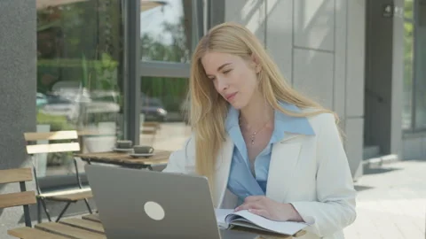 Smiling Freelancer Enjoying Remote Work Session At Outdoor Cafe Stock Footage 313838896