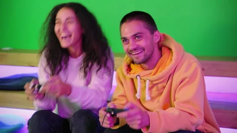 Smiling friends having fun and enjoying video game Stock Footage 150169580