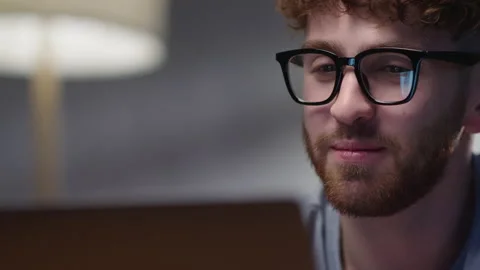Smiling Funny Man Talking to Girlfriend, Dister or Distance Teacher During Stock Footage 165071135