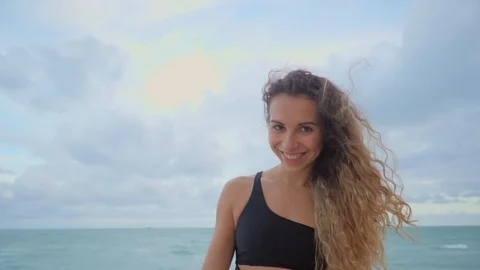 Smiling girl posing on a beach. Stock Footage 96157569